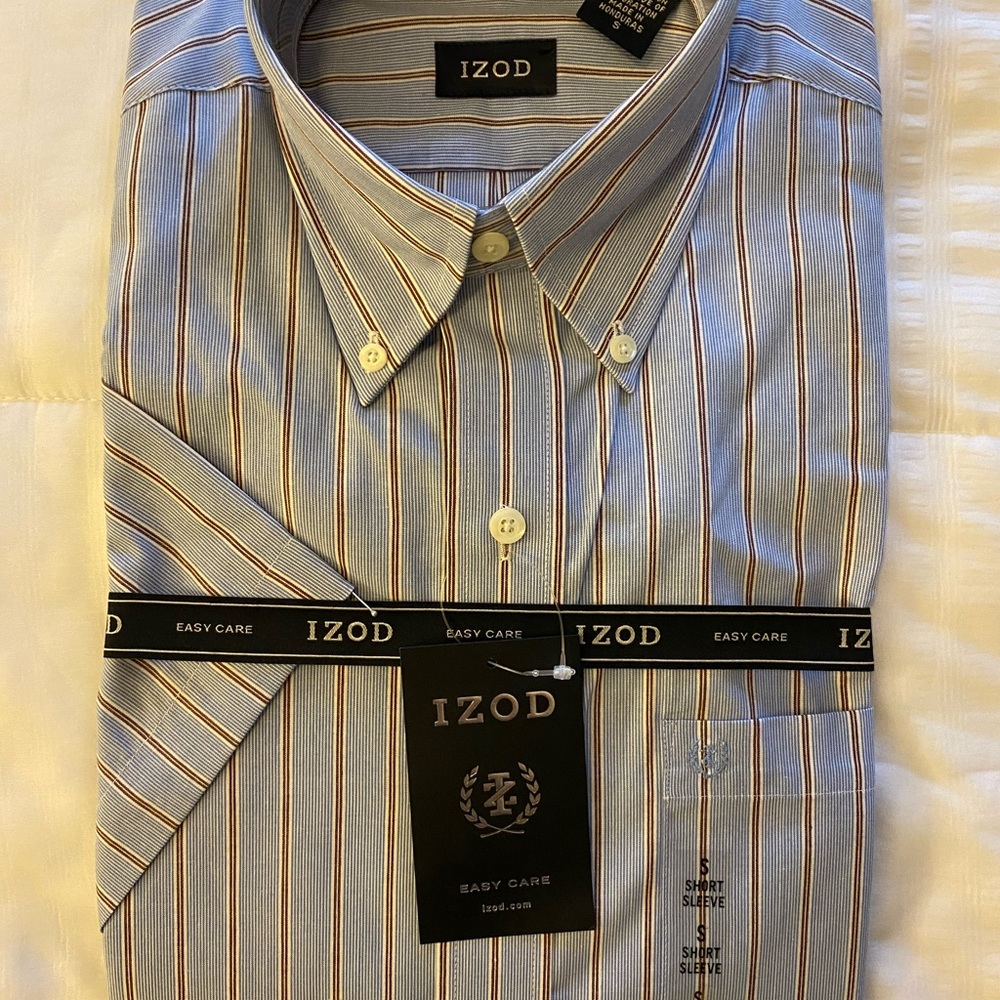 Never been opened. New Izod Shortsleeve with tags and logo ribbons. Size Small.